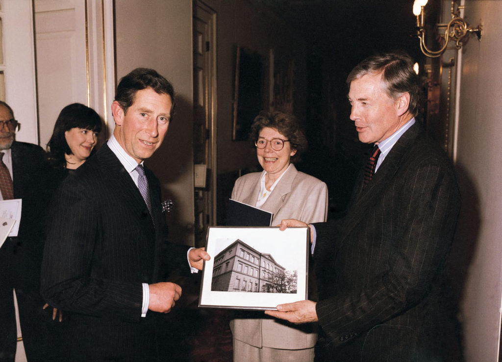 Prince Charles being presented with a photograph of the English College.